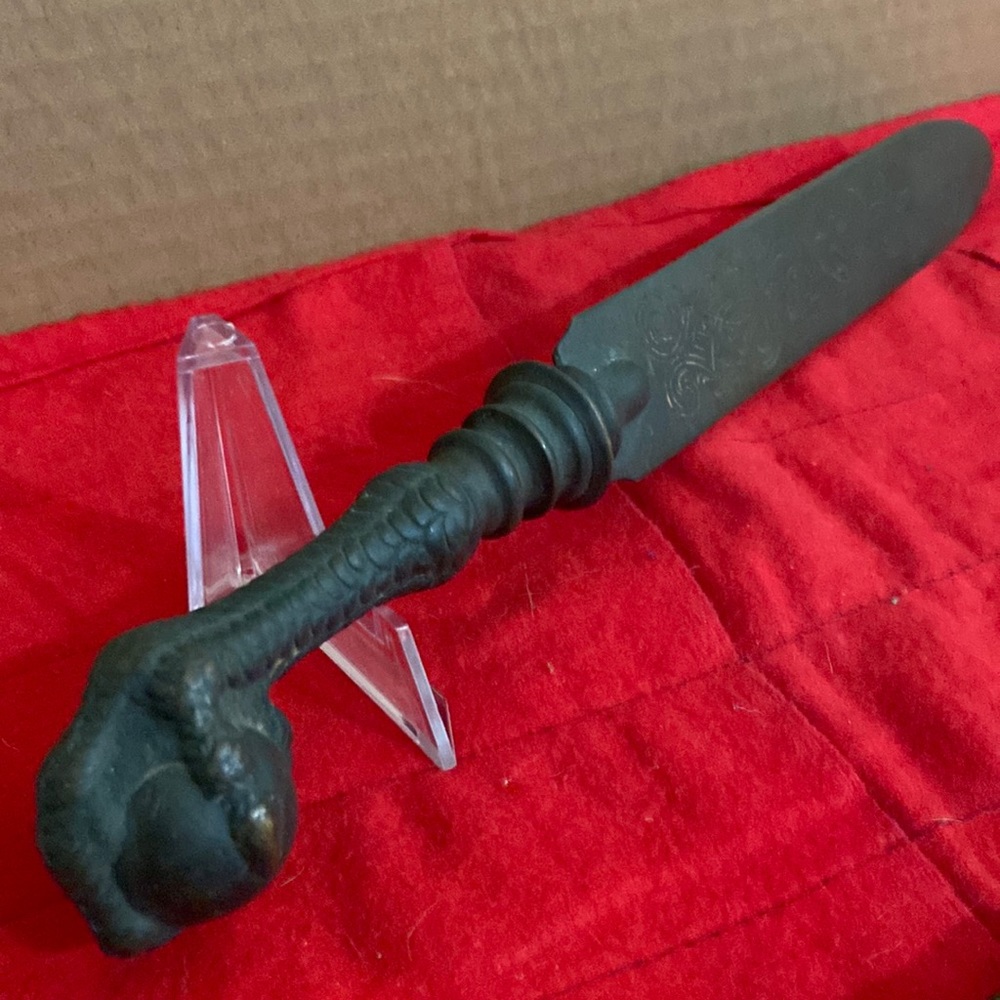 Bronze letter, opener, ball, and claw with etching 10 inches long